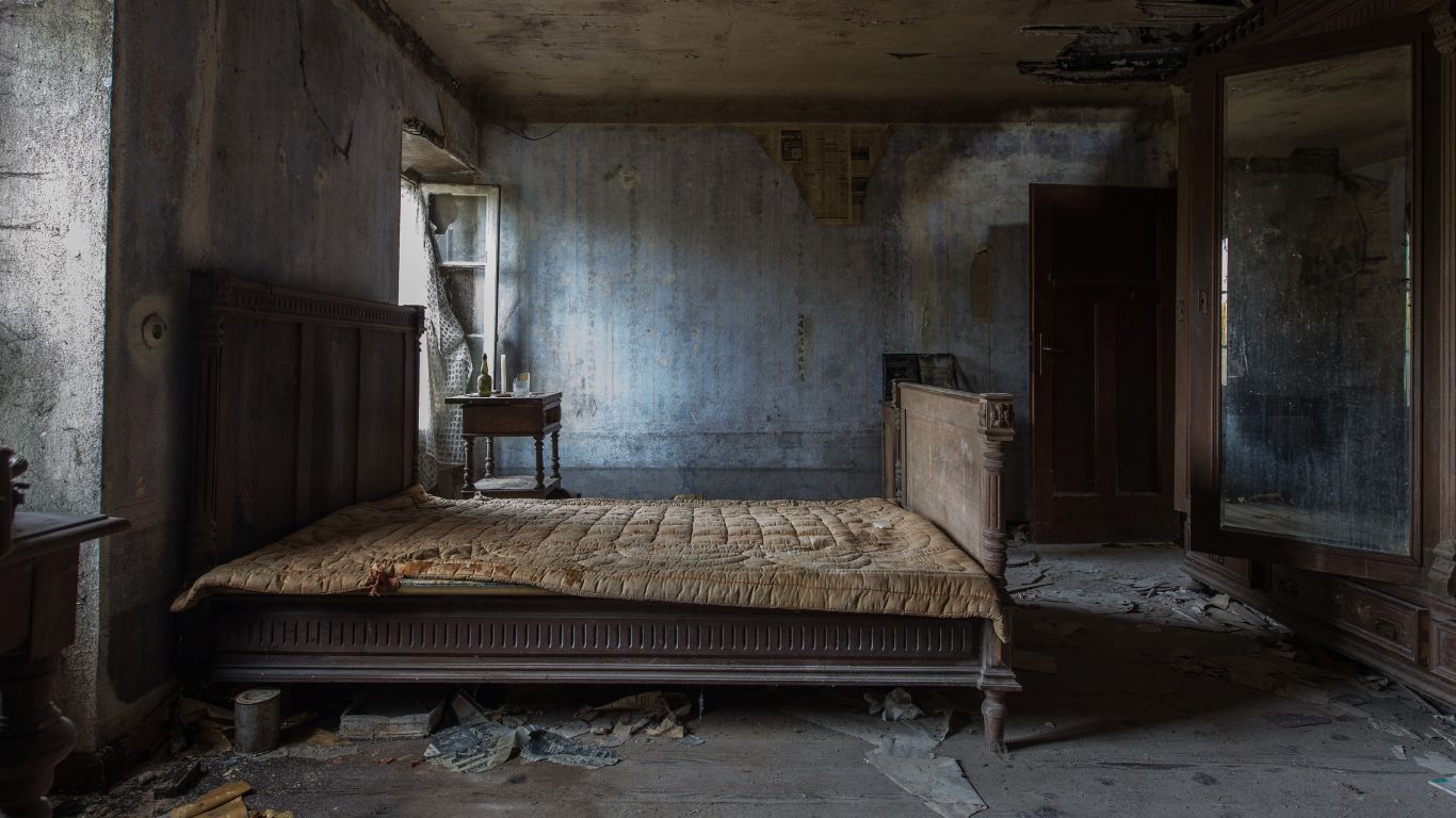 Bedroom with severe smoke and soot damage requiring professional fire damage restoration.